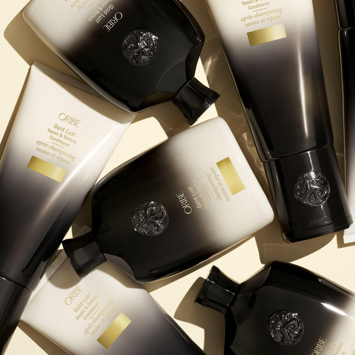 ORIBE Gold Lust Shampoo on a wooden surface
