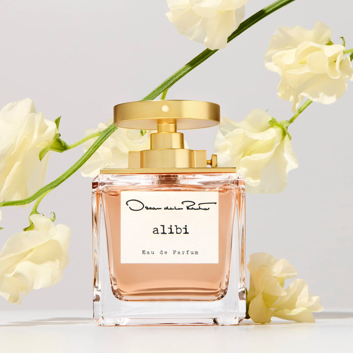 Oscar de la Renta Alibi Eau de Parfum bottle side view