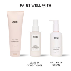 OUAI Curl Defining Cream on a bathroom shelf