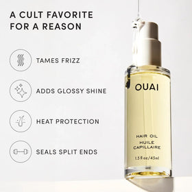 OUAI Hair Oil in hand with a background