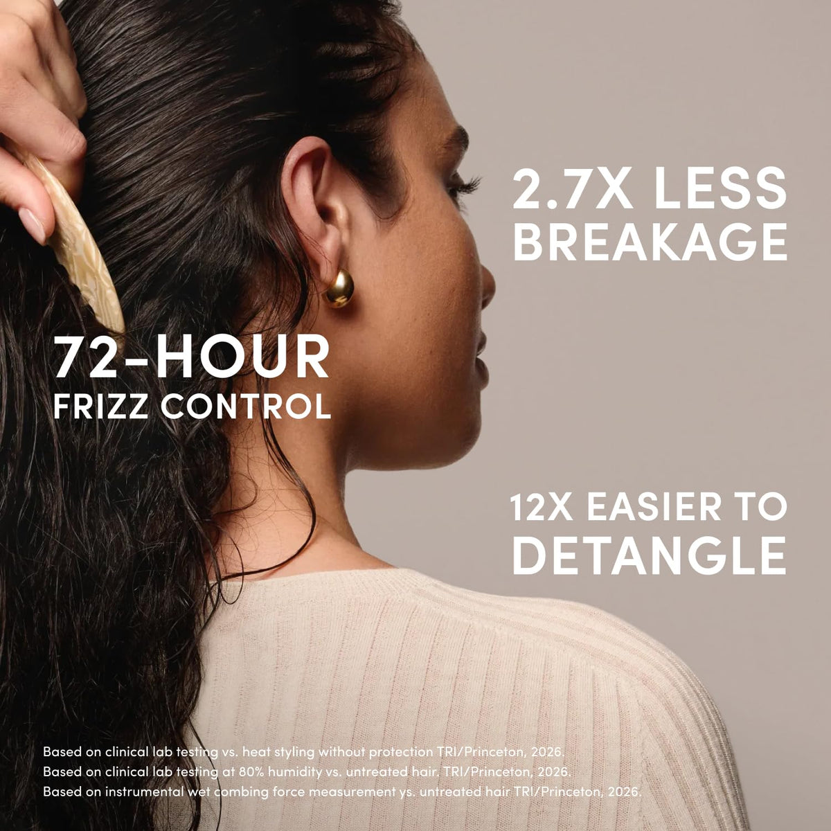 OUAI Leave In Conditioner next to hair styling tools