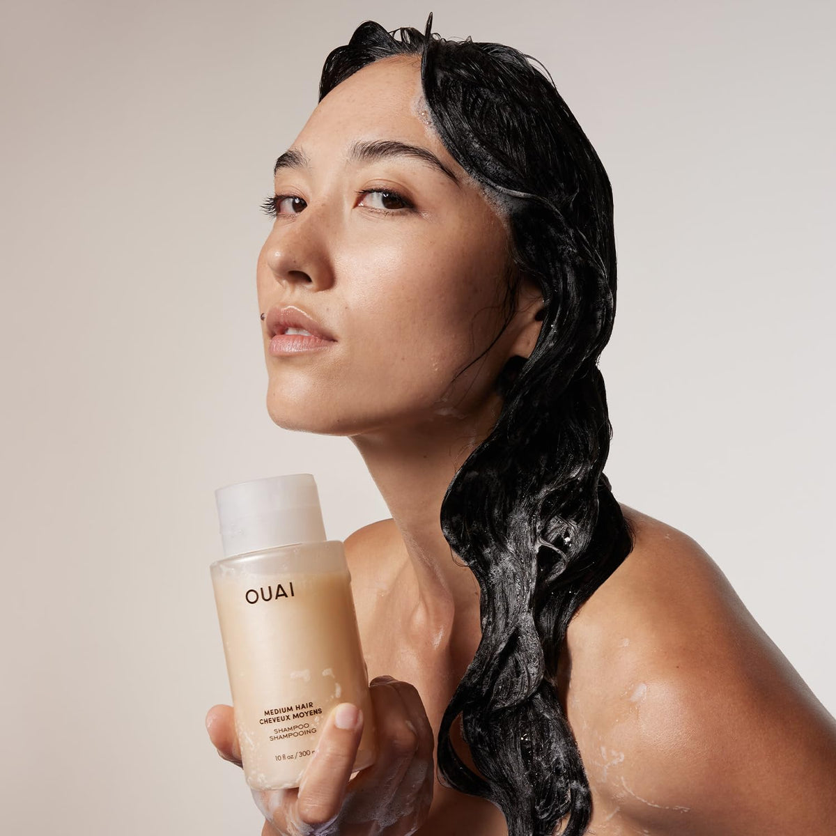 OUAI Medium Hair Shampoo in a bathroom setting
