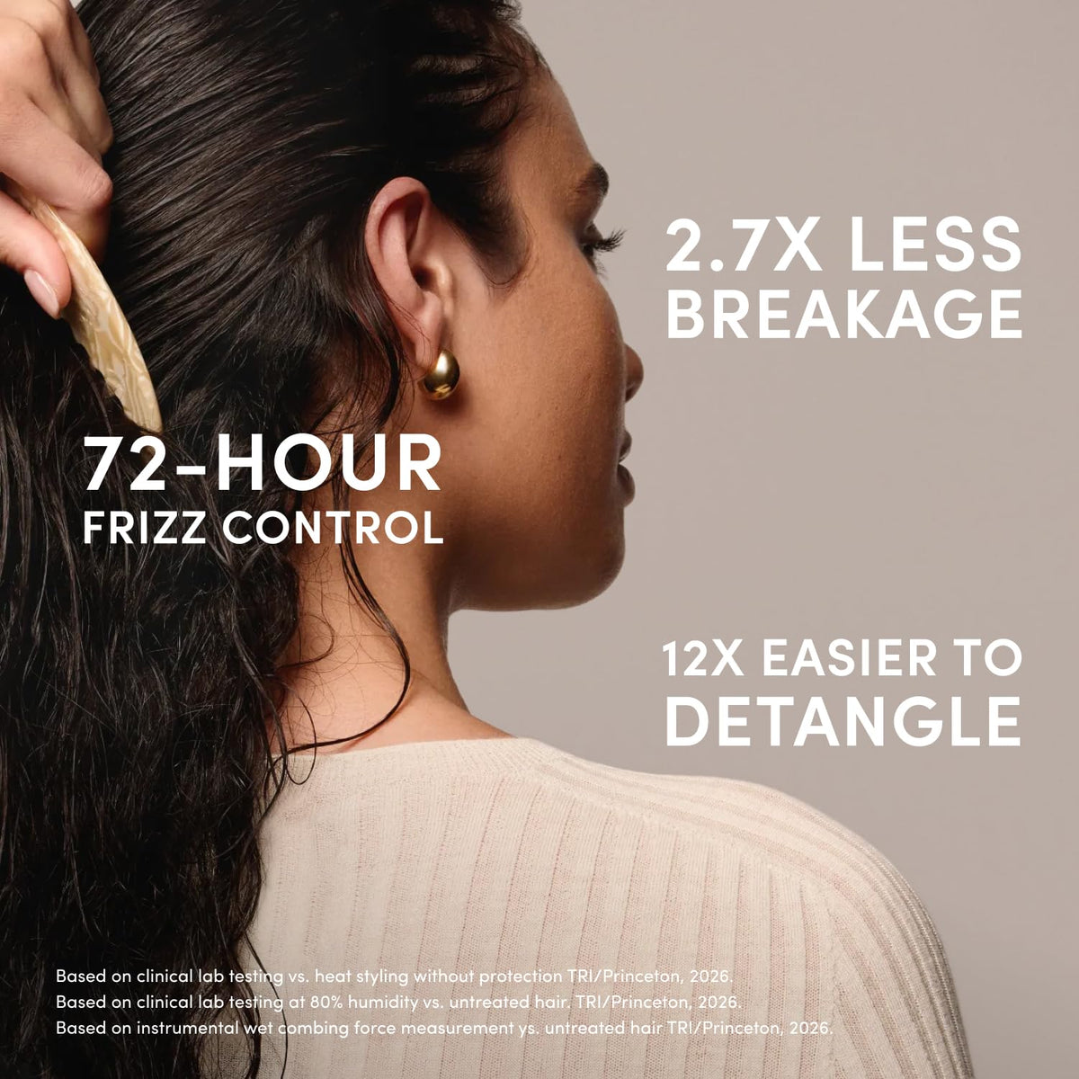 OUAI Multitasking Leave In Conditioner on a bathroom shelf