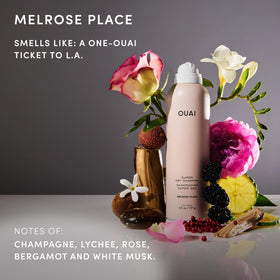 OUAI Super Dry Shampoo can on a travel bag