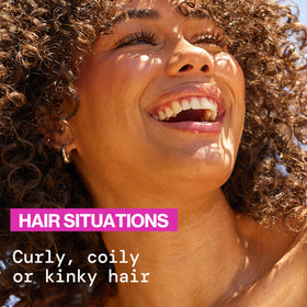 Pacifica Pineapple Curls Shampoo and Conditioner set in a vibrant shower setting
