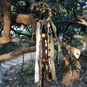 Packaging of dreadlock hair ties showing brand and features