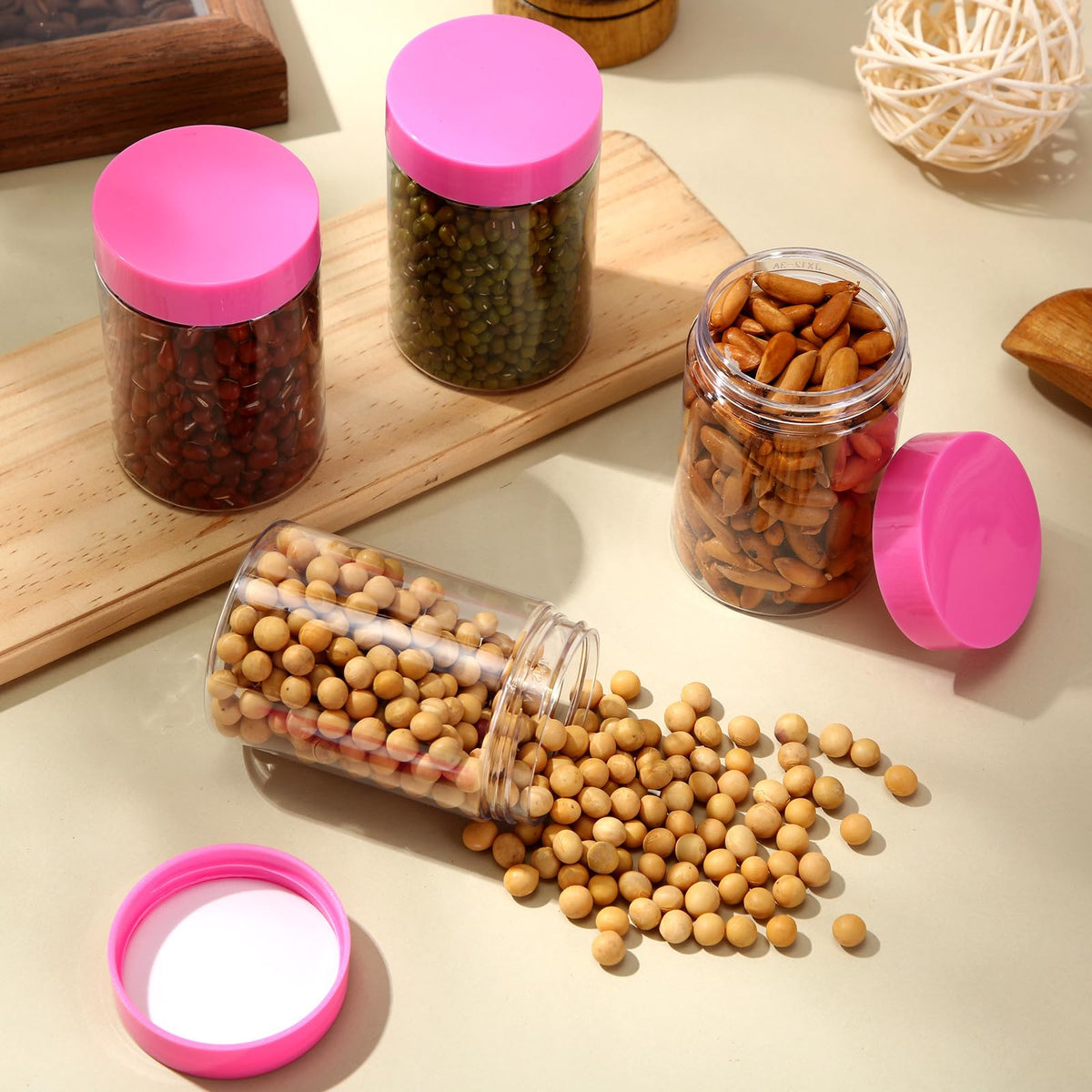 Patelai 4 Pack of Refillable Plastic Jars with Lids, arranged