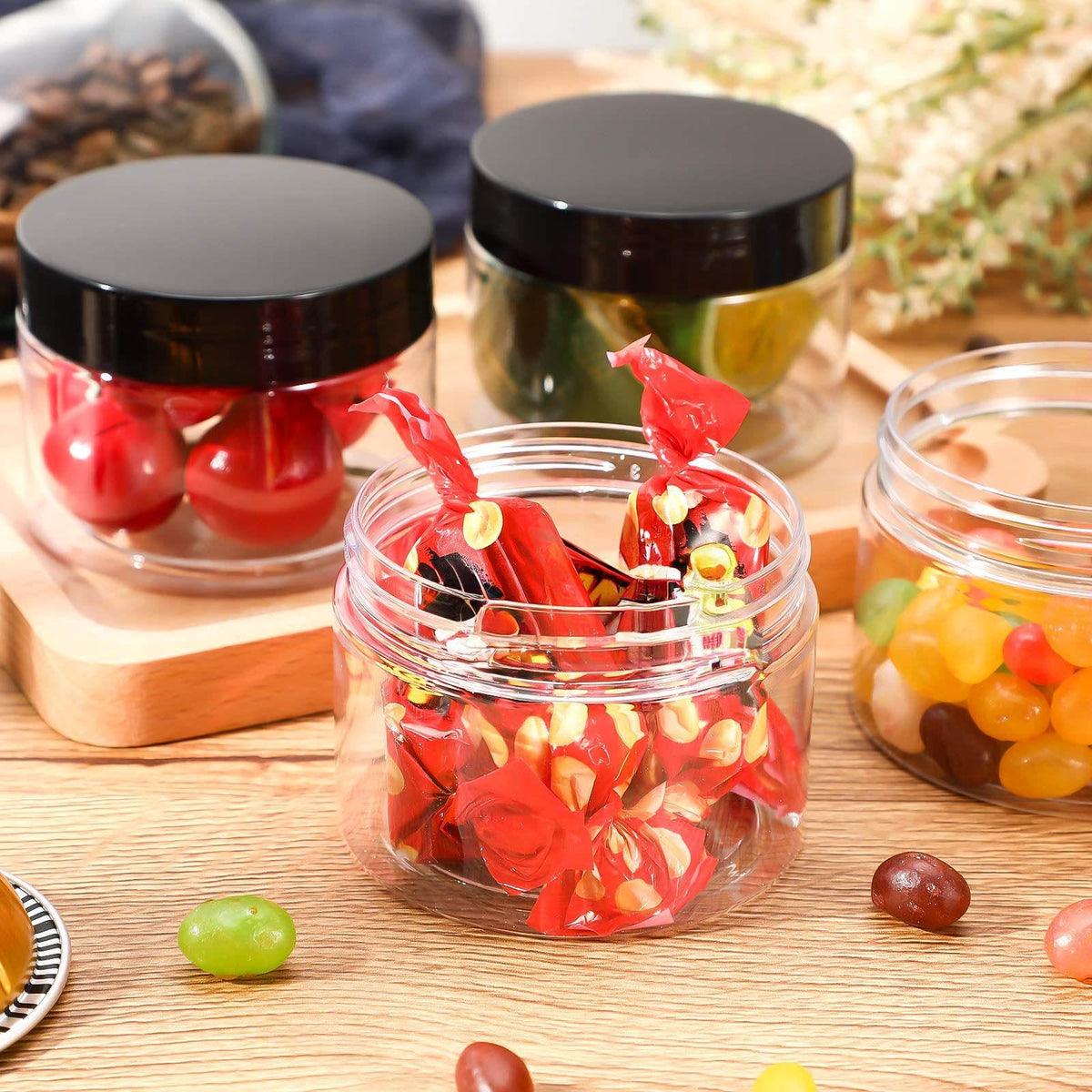 Patelai plastic jars with screw-on lids on a table