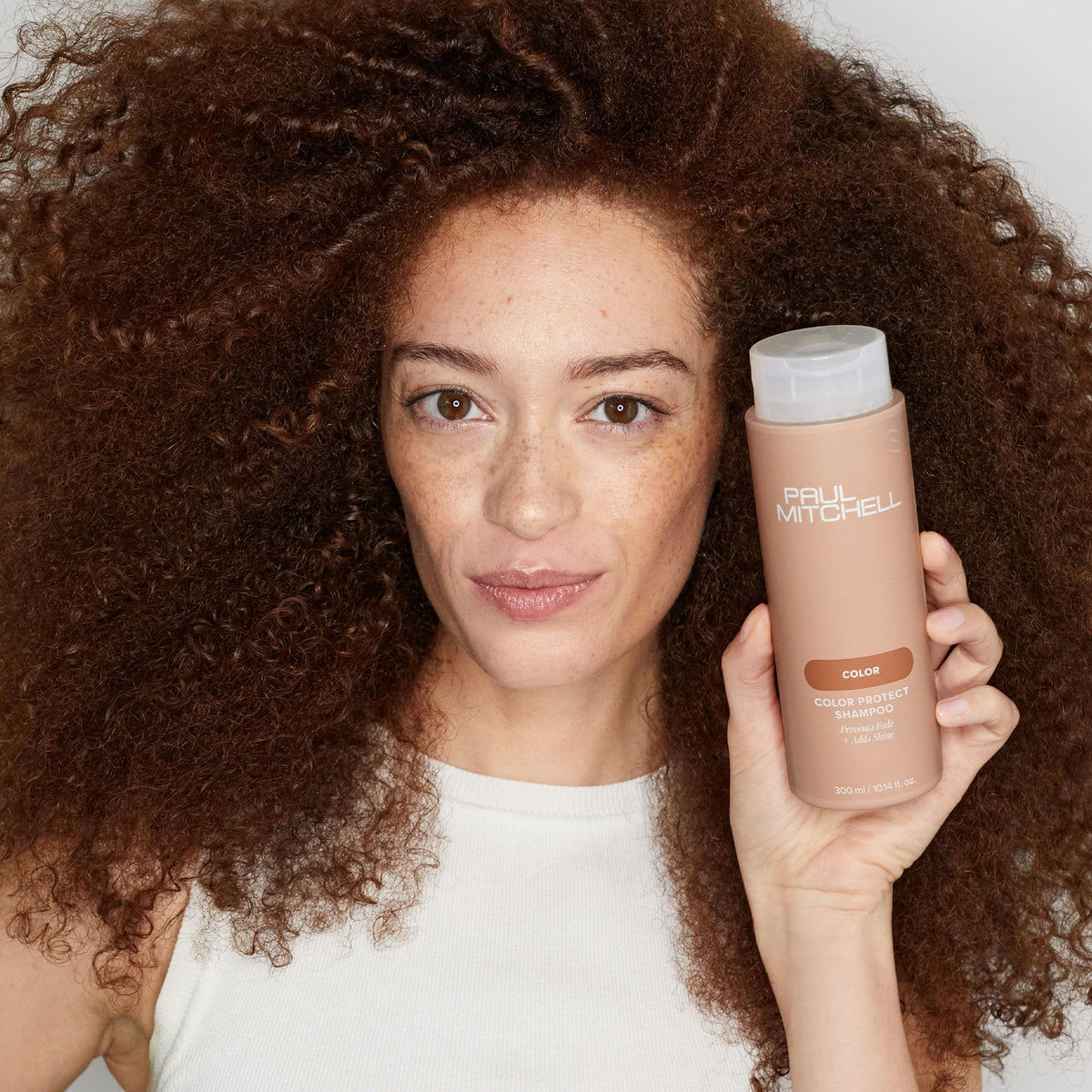 Paul Mitchell Color Protect Shampoo on a bathroom shelf