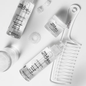 Paul Mitchell Detangler Comb held in hand for easy use