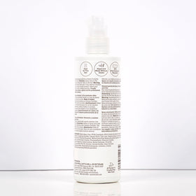 Paul Mitchell Extra-Body Root support Volumizing Spray in a bathroom setting