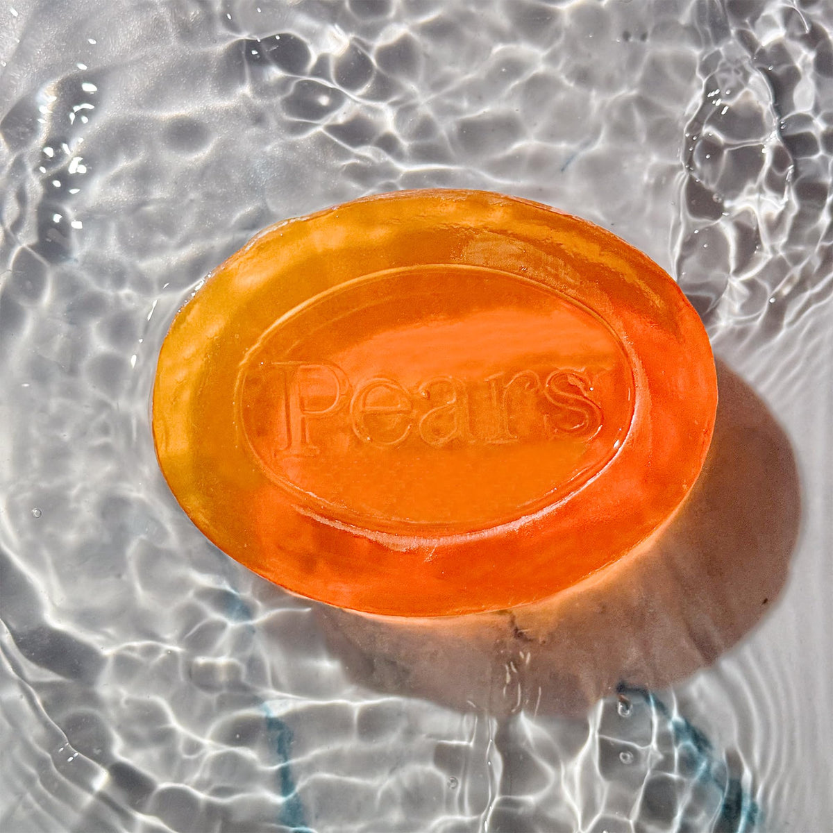 Pears Soap bar on a soap dish with water droplets
