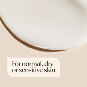 Person applying Aveeno Daily Moisturizing Body Lotion