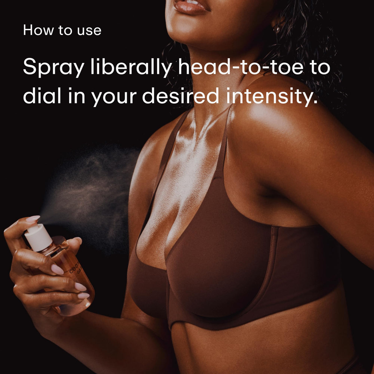 PHLUR Coconut Skin Body Mist misting on skin