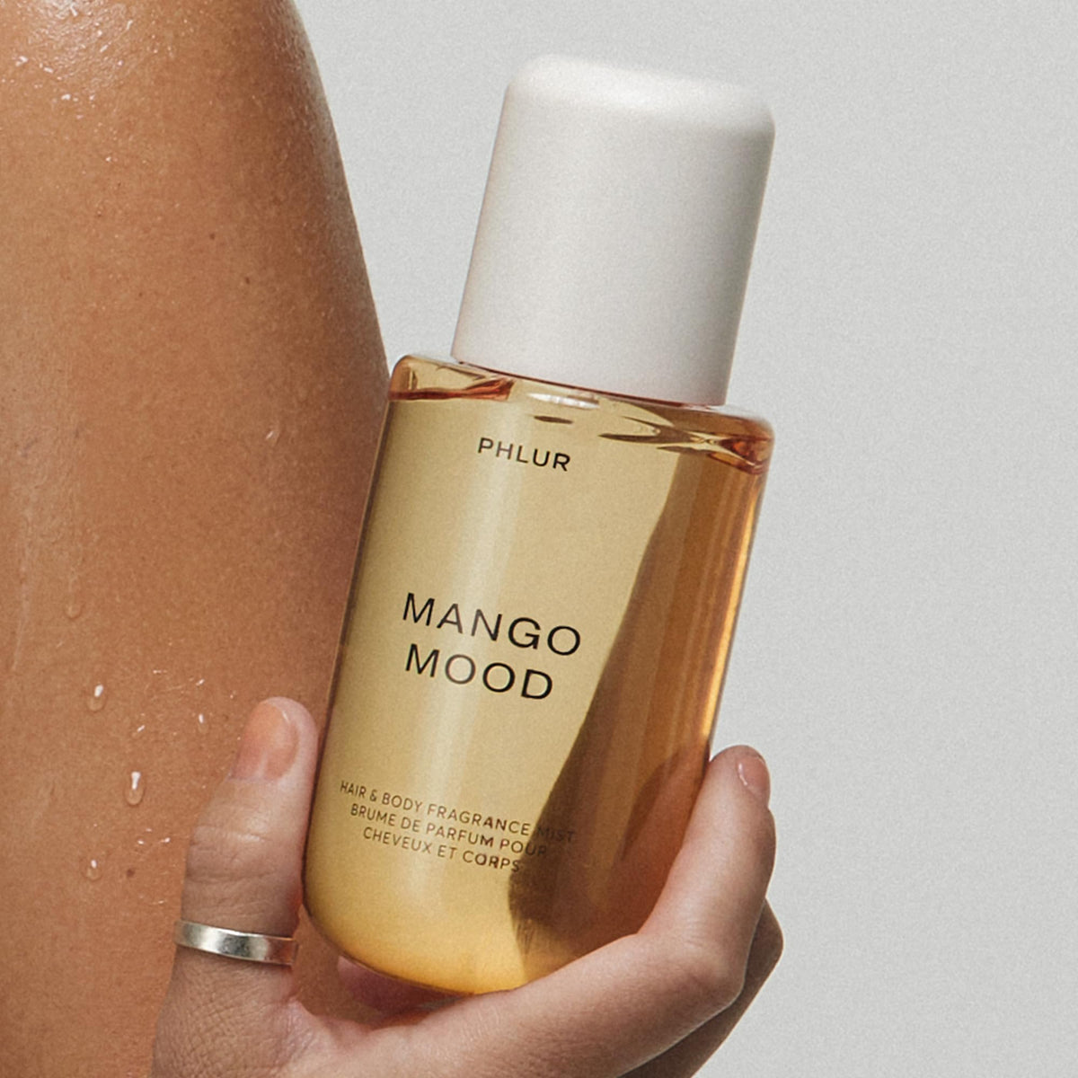 PHLUR Mango Mood Body Mist spray nozzle close-up