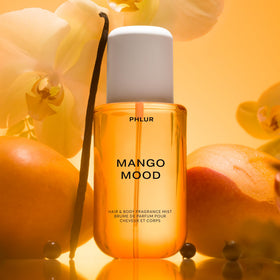PHLUR Mango Mood Body Mist with tropical background