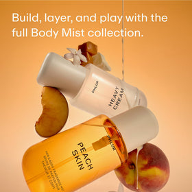 PHLUR Peach Skin Body Mist on a vanity