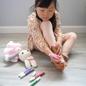 Piggy Paint Nail Polish Pen applied on nails with designs