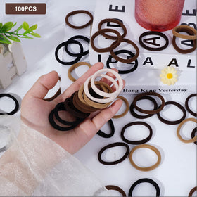 Pimoys Elastic Hair Ties in a hand demonstrating stretch