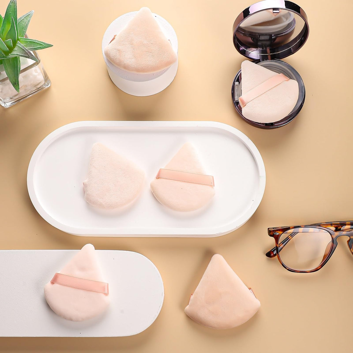 Pimoys powder puffs in various angles showcasing design