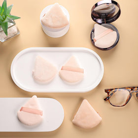 Pimoys powder puffs in various angles showcasing design