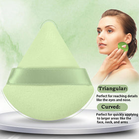 Pimoys round powder puff demonstrating its use on foundation