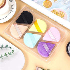 Pimoys Triangle Powder Puff in hand for easy handling