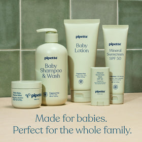 Pipette Baby Shampoo + Wash in a baby's bath setup with toys
