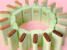 Pixi On-the-Glow Base Tinted Moisturizer Stick in hand