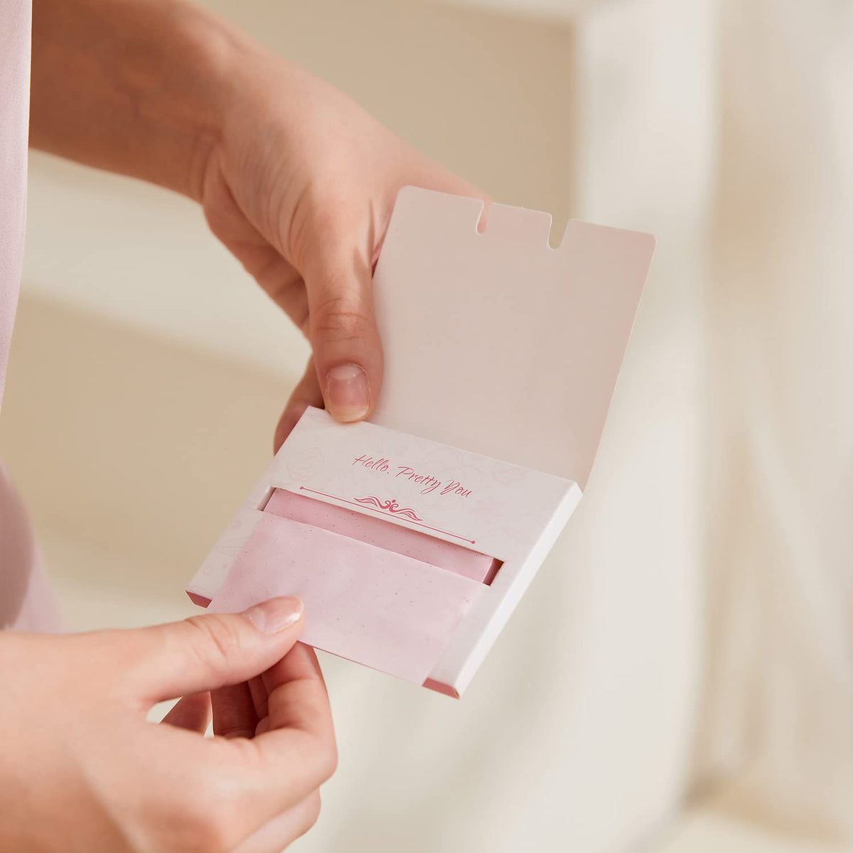 PleasingCare Large Face Oil Blotting Sheets in use on a face