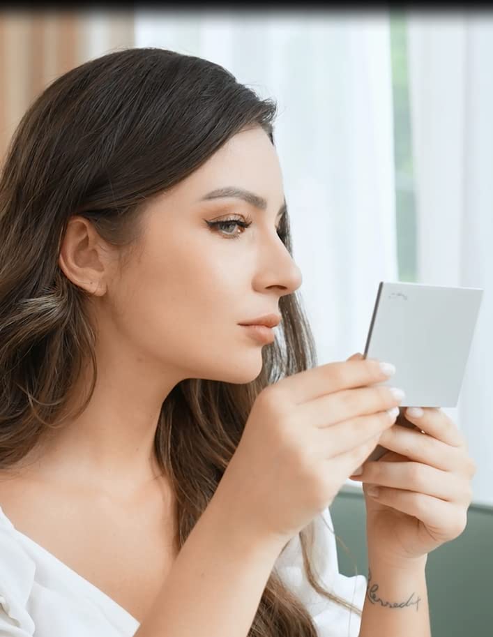 PleasingCare makeup mirror and blotting paper in a handbag