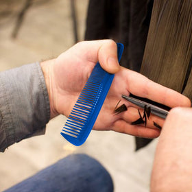 Portable Soft 'N Style comb in a pocket