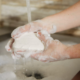 Pre de Provence Coconut Soap Bar on a soap dish
