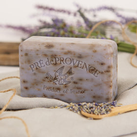Pre de Provence Lavender Soap Bar on a wooden soap dish