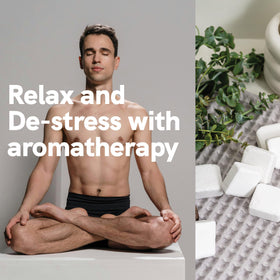 Pure Athlete shower steamers displayed with eucalyptus leaves