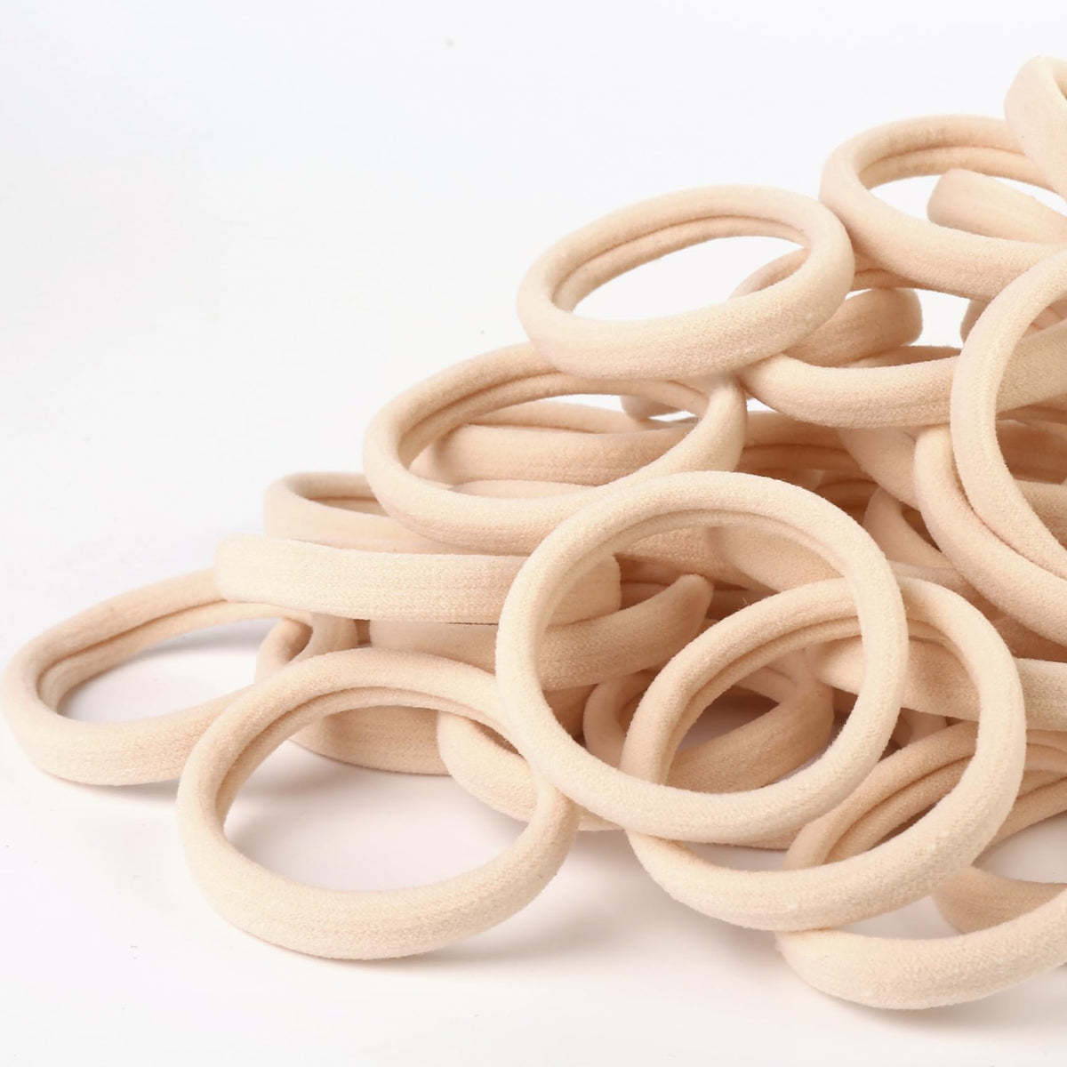 Qarwayoc Large Blonde Hair Ties displayed on a hair styling surface