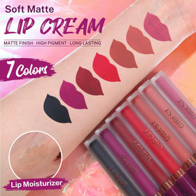 QiBest lip plumper tube next to lipsticks
