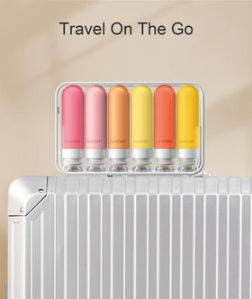 Quatish Travel Bottles in a suitcase ready for travel
