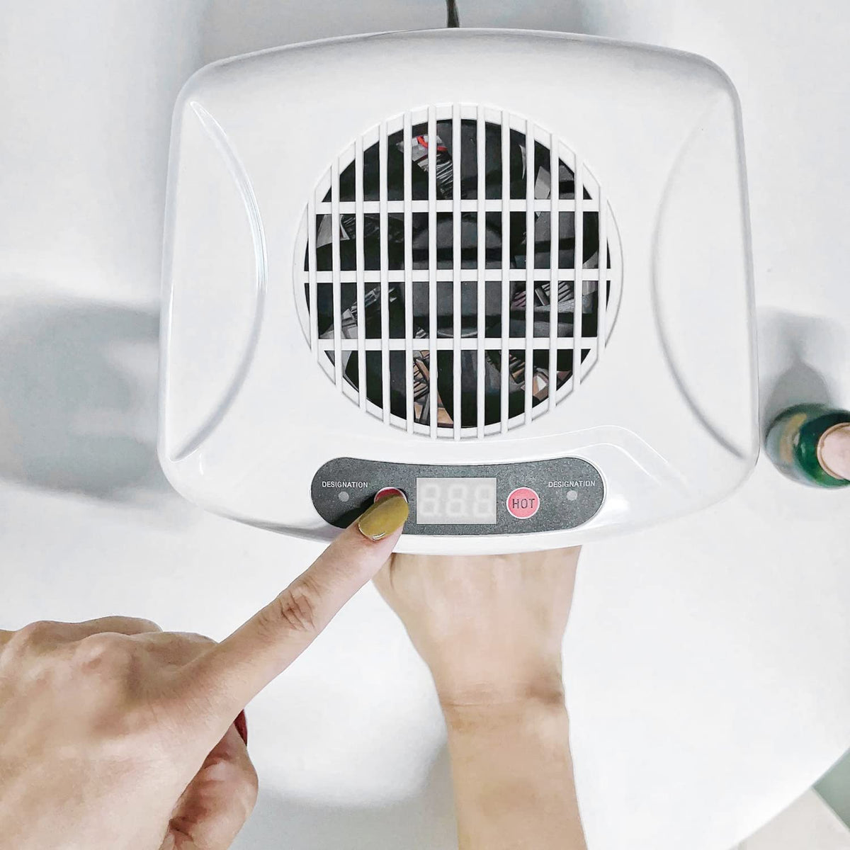 QUTUNI Nail Dryer 300W in use during a home manicure