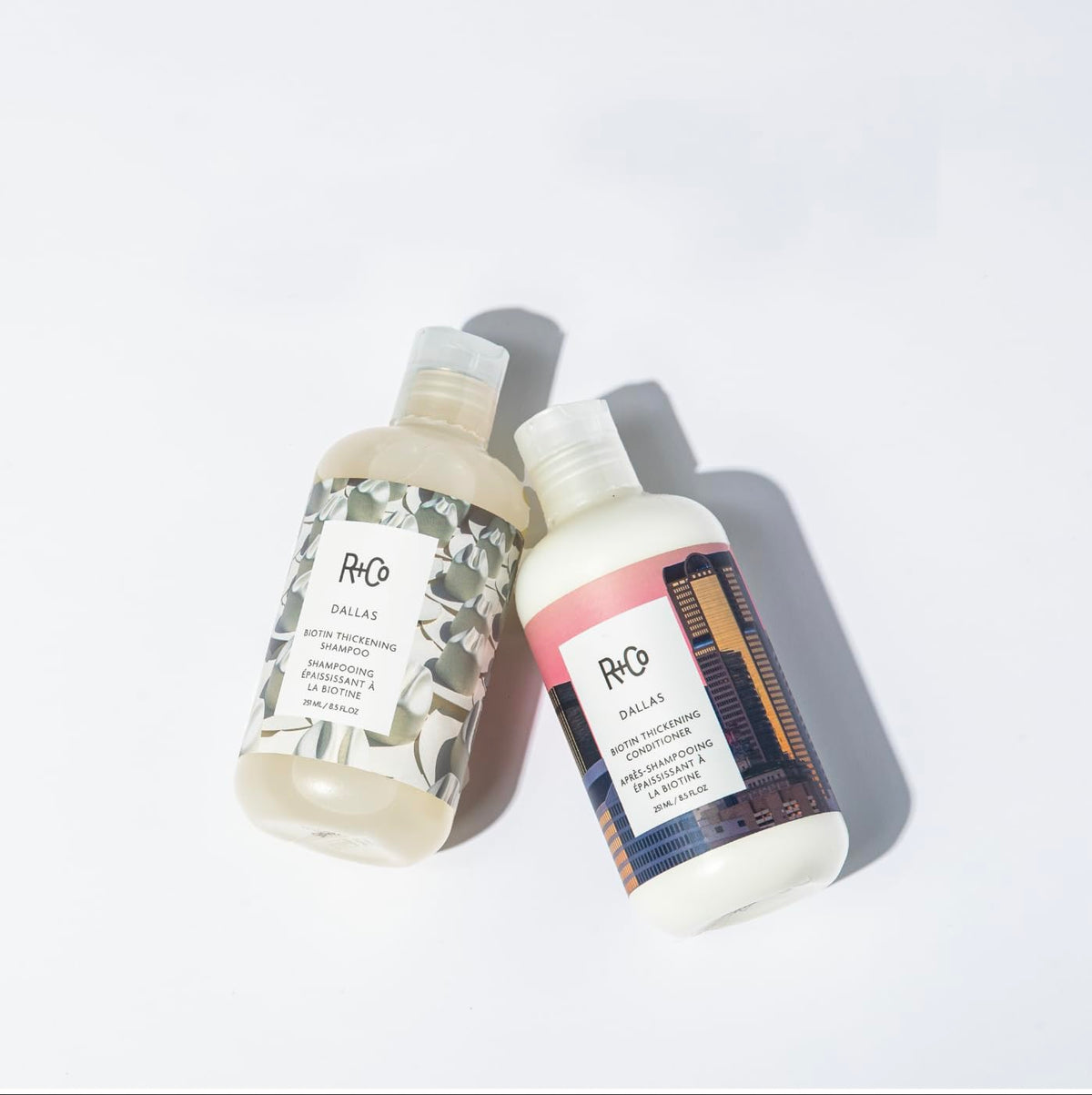 R+Co Dallas Biotin Thickening Conditioner 8.5 Oz on a vanity