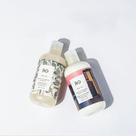 R+Co Dallas Biotin Thickening Conditioner 8.5 Oz on a vanity