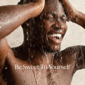 RAW SUGAR Charcoal Bamboo Reset Body Wash lifestyle image with towels