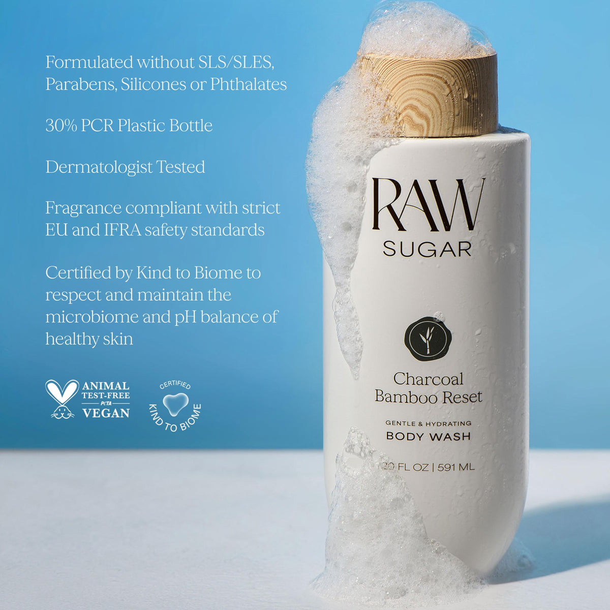 RAW SUGAR Charcoal Bamboo Reset Body Wash with bamboo leaves background