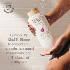 RAW SUGAR Lemon Citrus Energizer Body Wash on a bathroom shelf