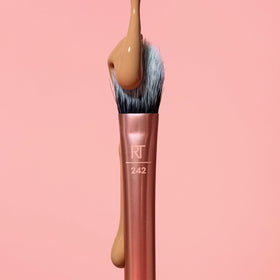 Real Techniques Brightening Concealer Brush in use applying makeup