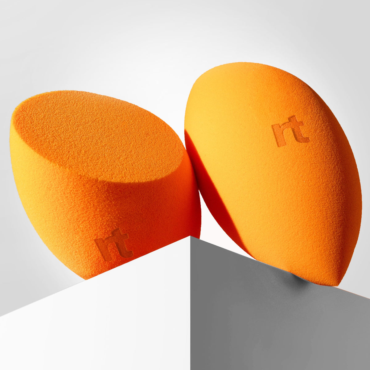 Real Techniques Miracle Complexion Sponge Duo showcasing rounded side for blending