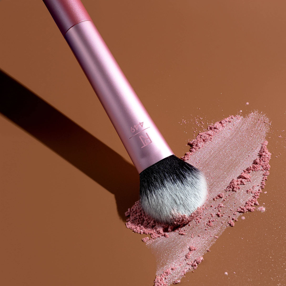 Real Techniques Tapered Cheek Blending Brush RT 449 on a makeup table