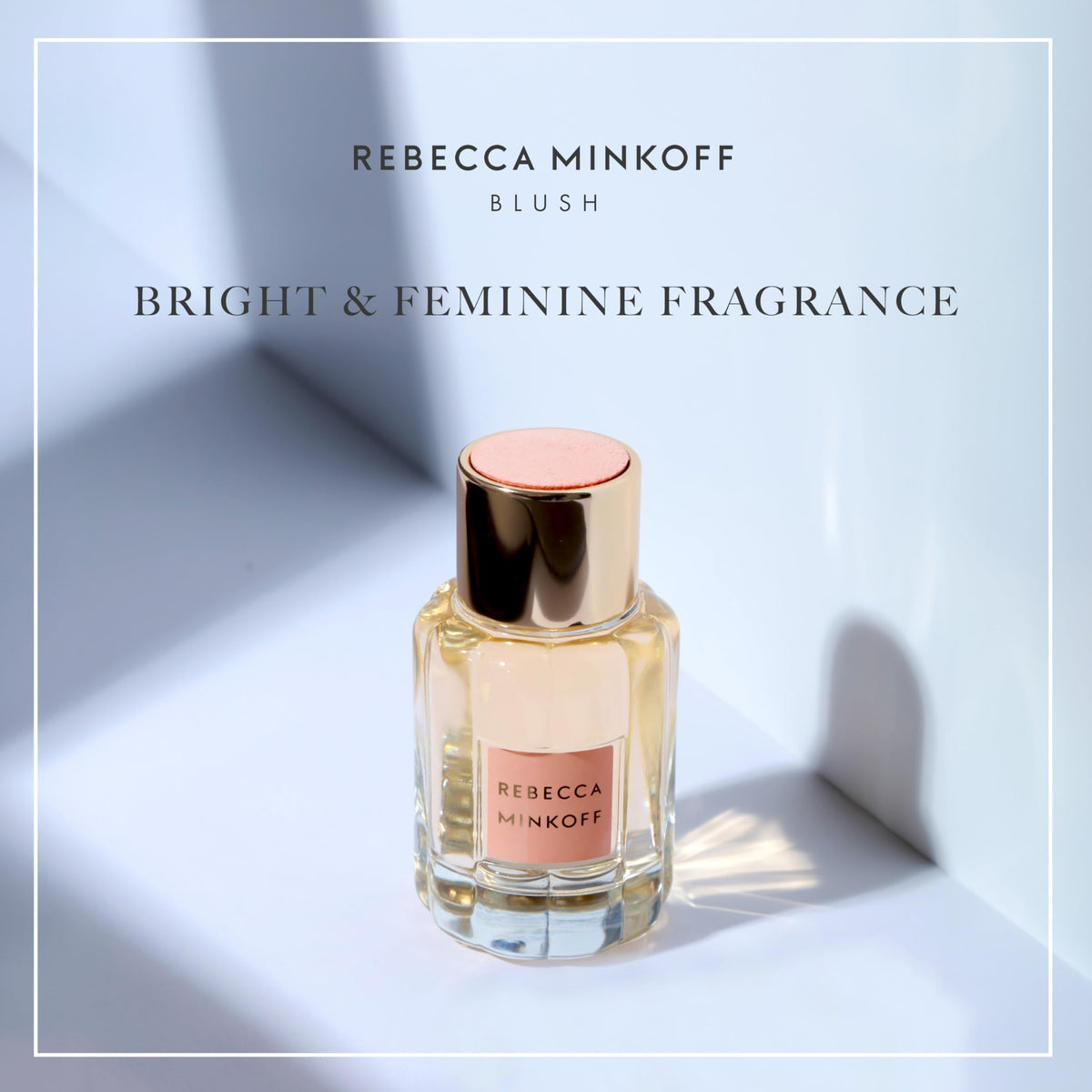 Rebecca Minkoff Blush Eau de Parfum bottle with gold top and pink accents