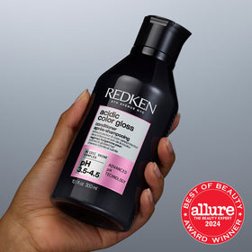 Redken Acidic Color Gloss Conditioner packaging on a shelf