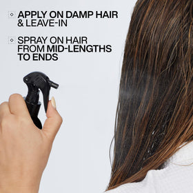 Redken Acidic Color Gloss Leave-In Spray on a vanity